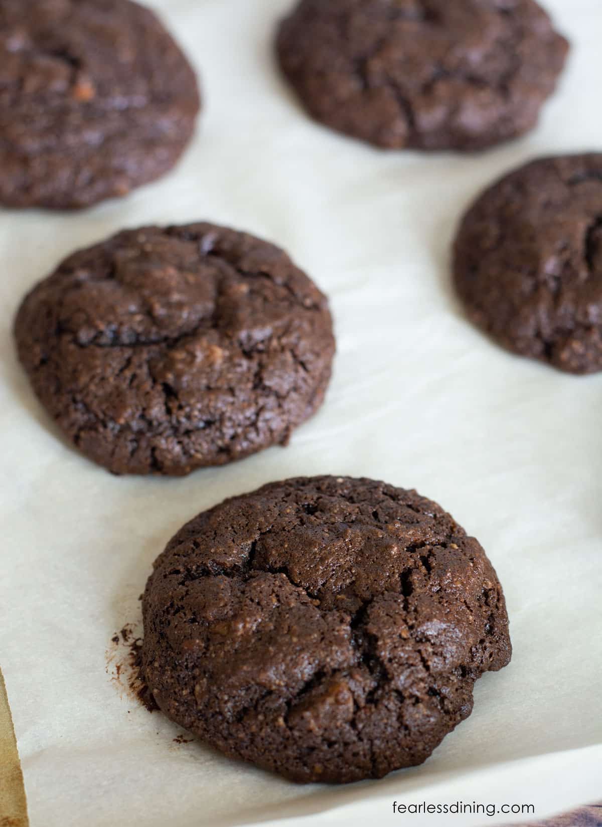 Baked gluten free cake mix cookies on a baking tray.