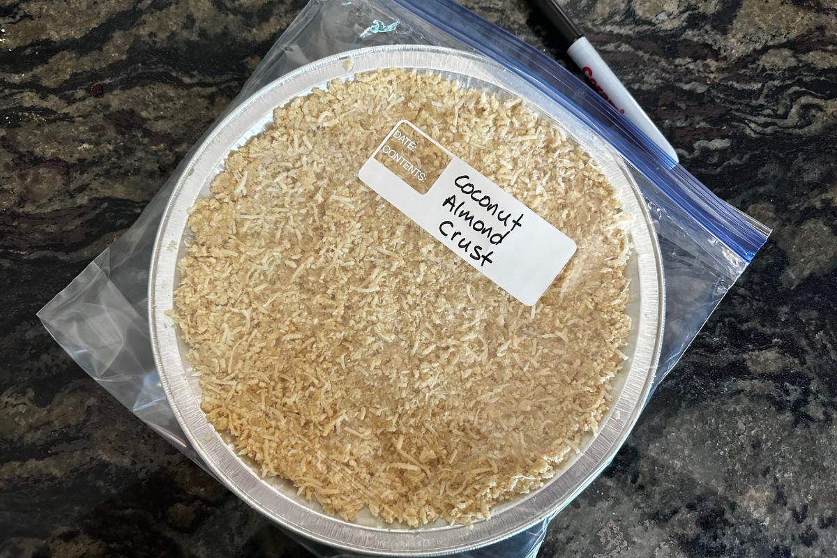 A coconut almond crust in a freezer bag.