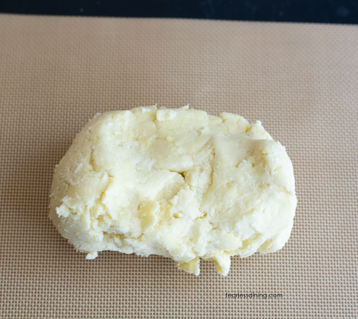 Gluten free galette dough on a silicone mat.