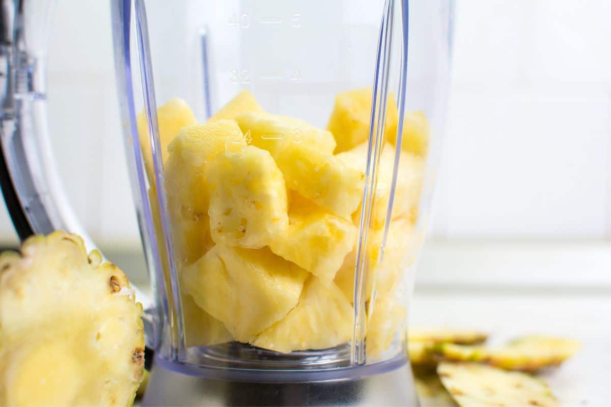 Pineapple chunks in a blender.