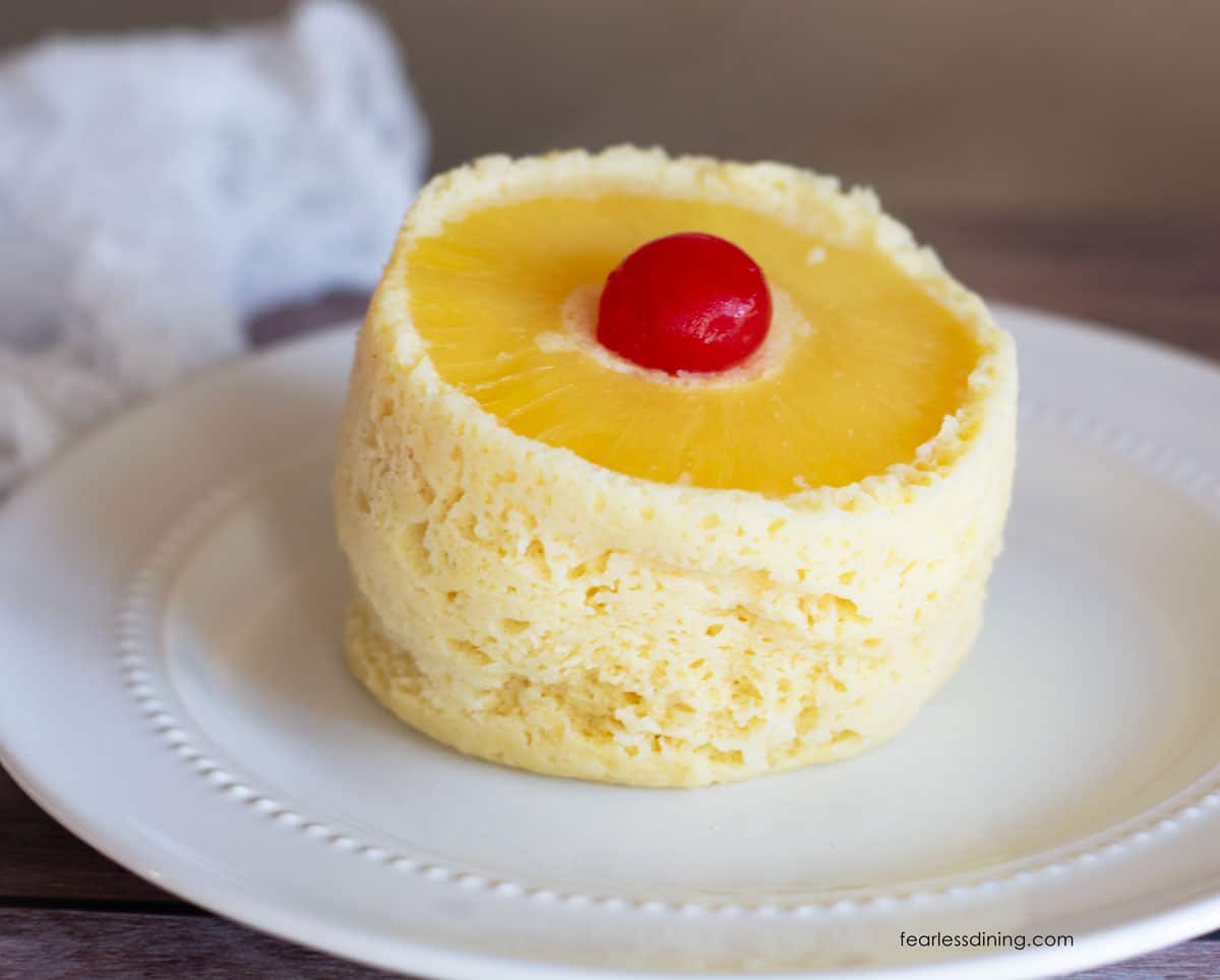 Another view of the pineapple upside down mug cake on the plate.