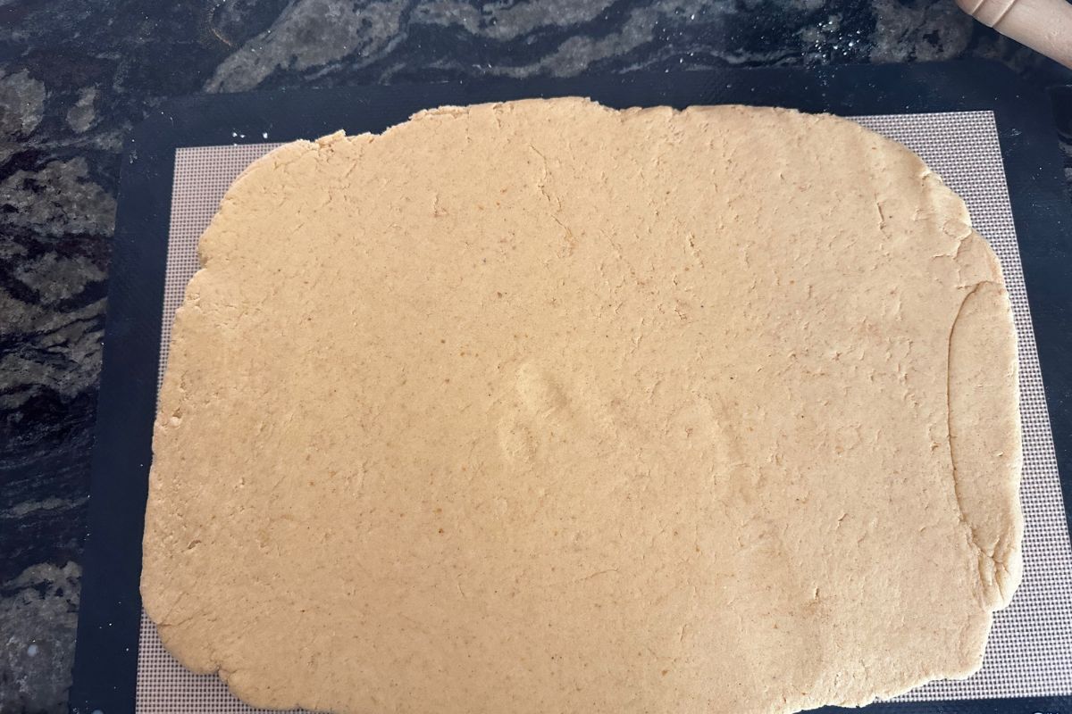 The rolled pumpkin dough on a silicone mat.