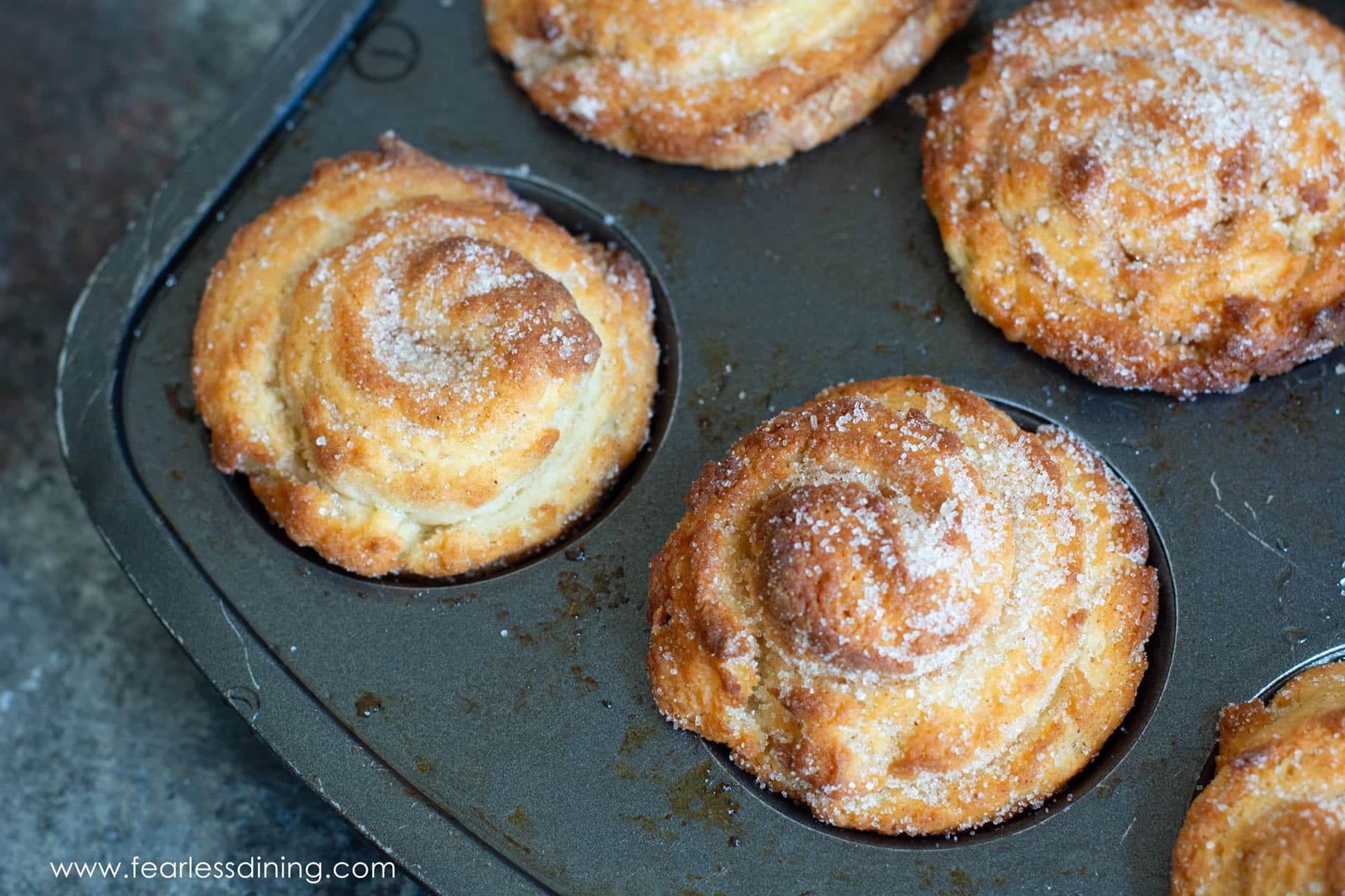 Baked cruffins in a muffin pan.