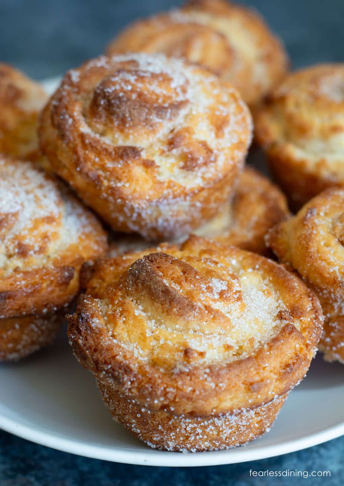 A batch of gluten free cruffins on a white plate.