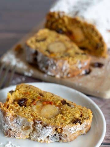 A close up of a slice of stollen so you can see the almond paste in the middle.