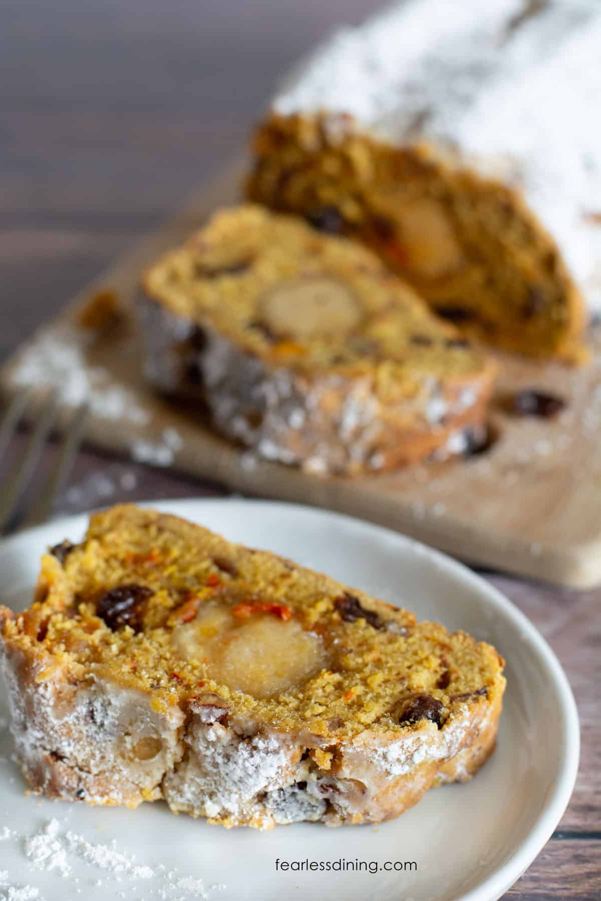 A close up of a slice of stollen so you can see the almond paste in the middle.