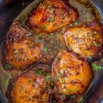 The cooked honey garlic chicken in the slow cooker.