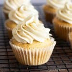 Two rows of frosted gluten free eggnog cupcakes.