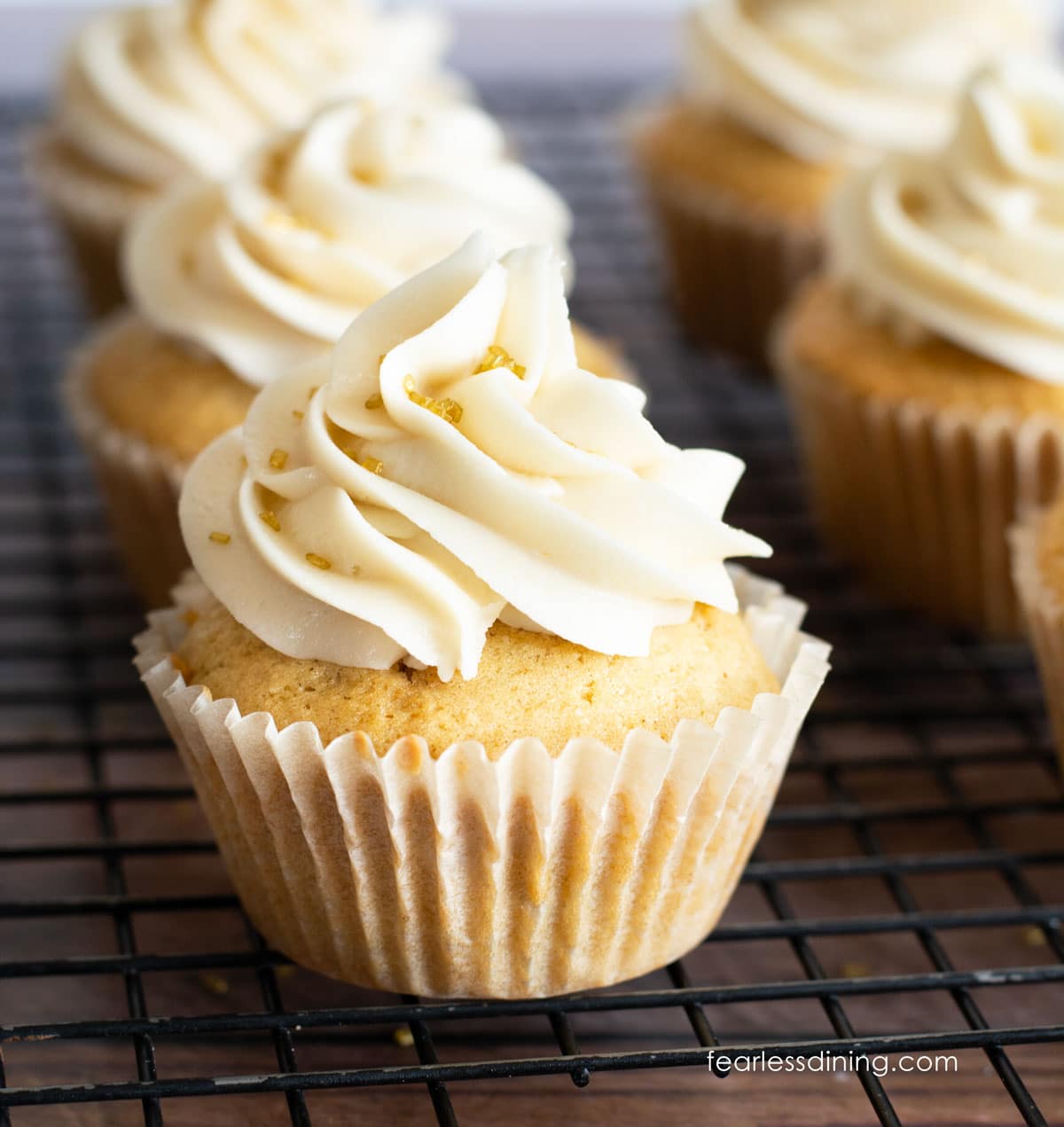 Two rows of frosted gluten free eggnog cupcakes.