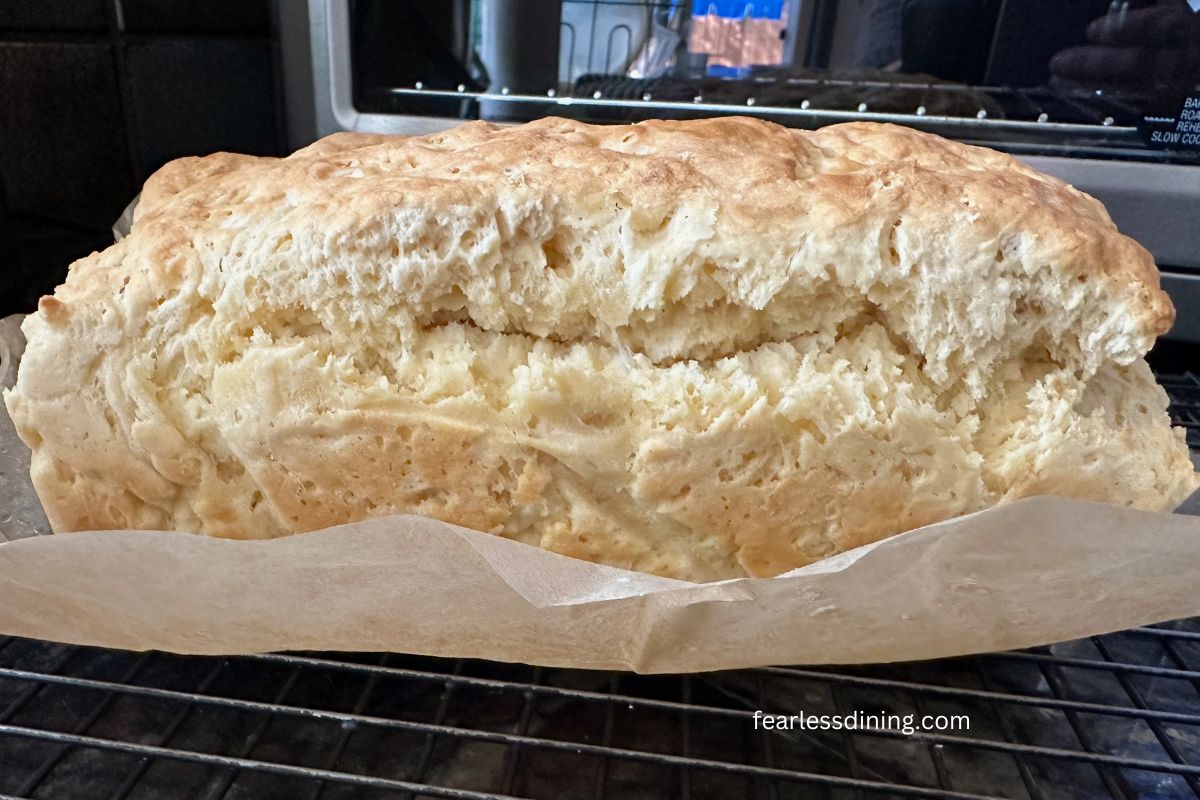 A photo of the baked bread on a cooling rack.