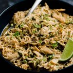 A serving bowl filled with slow cooker cilantro lime chicken.