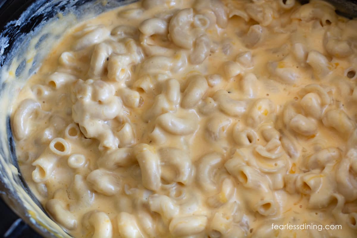 A close up of the cooked mac and cheese in the slow cooker.