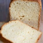A photo of the gluten free Hawaiian bread tested with Cup4Cup flour blend. It is sliced on a cutting board.
