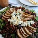 A grilled pear and blue cheese salad on a plate.