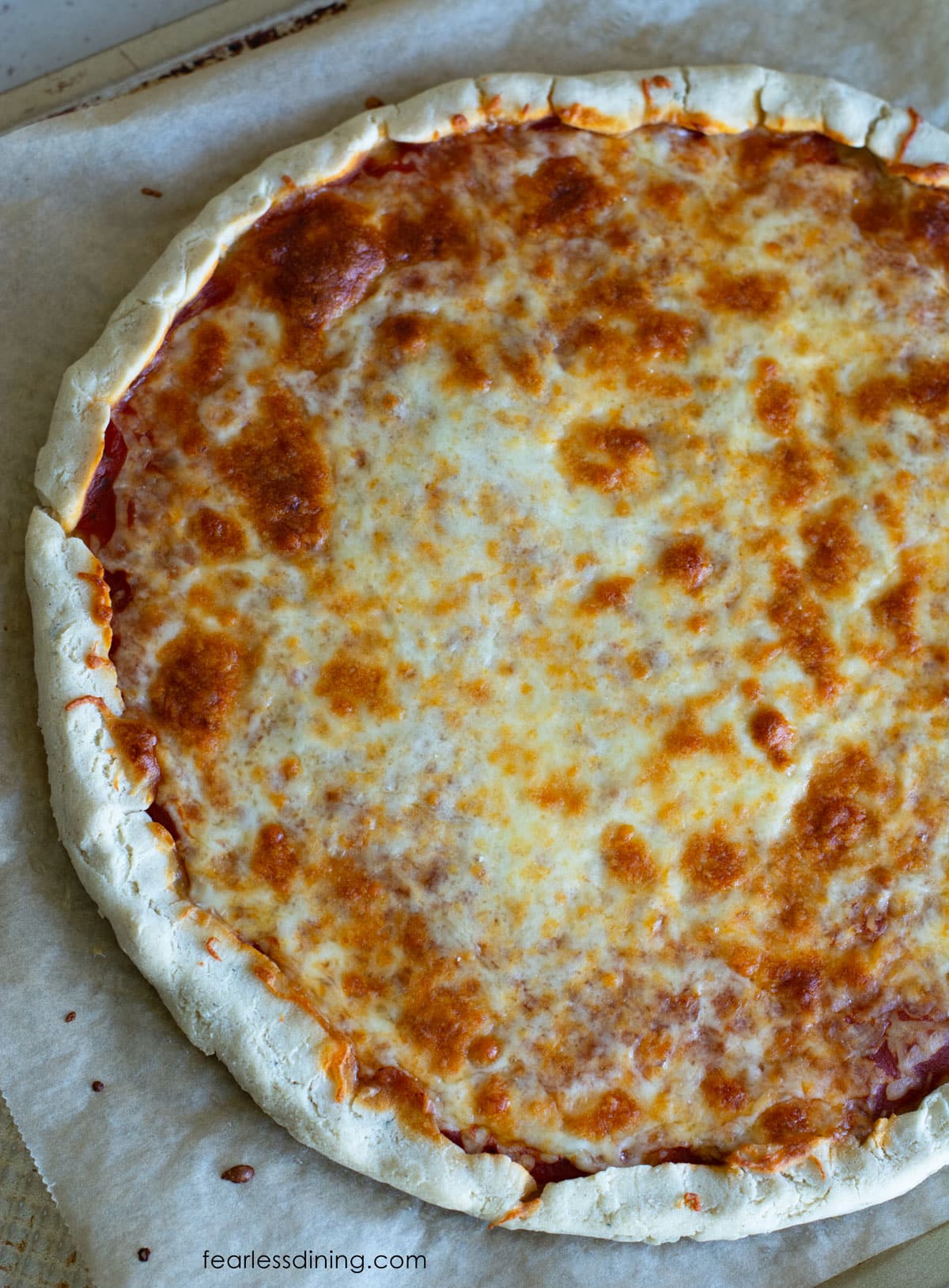 A photo of the top of the pizza baked with Bob's Red Mill 1:1 Gluten Free Flour Blend. The crust didn't get as fluffy as the Cup4Cup pizza.