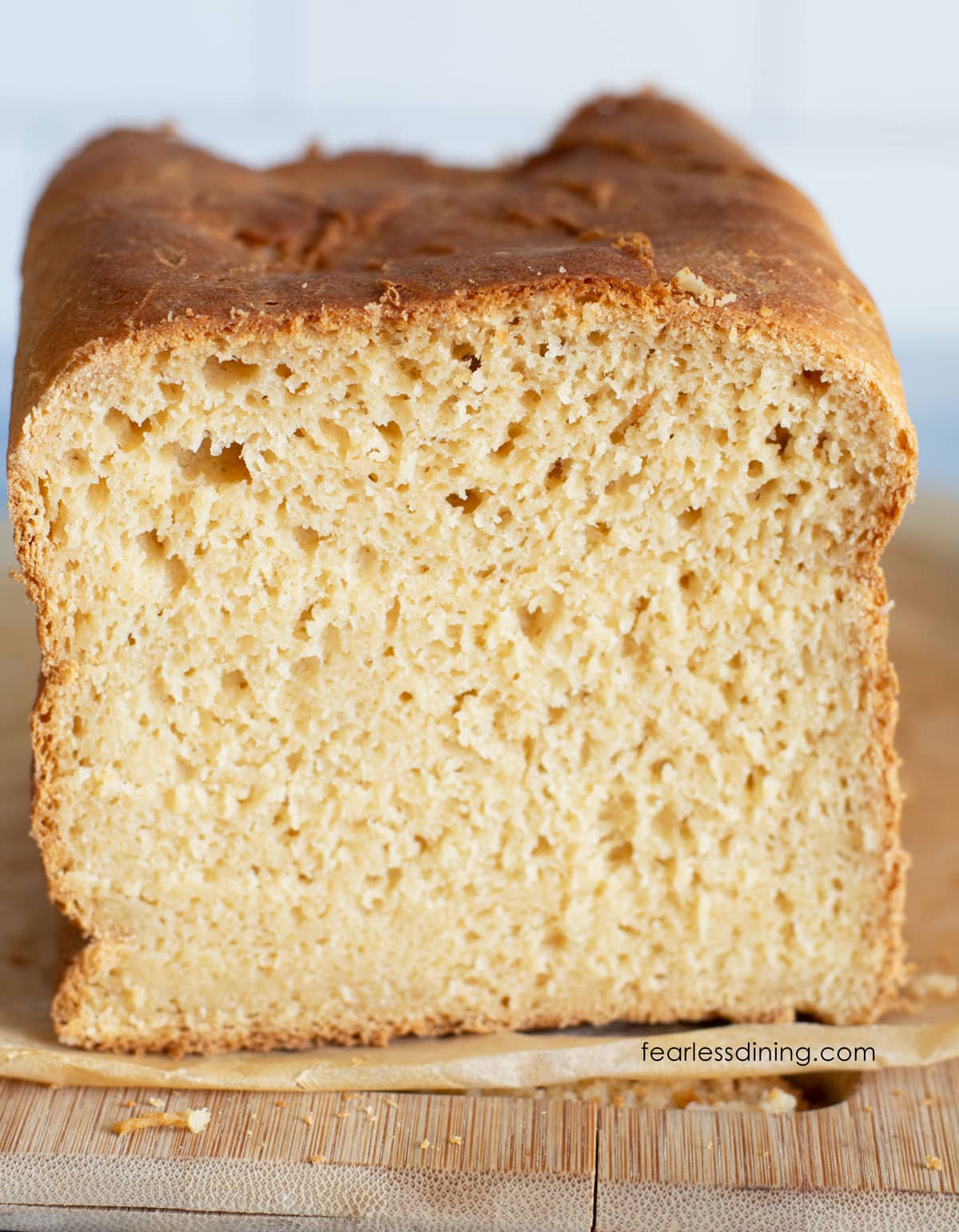 A loaf of gluten free Hawaiian bread with the ends sliced off so you can see the inside crumb.