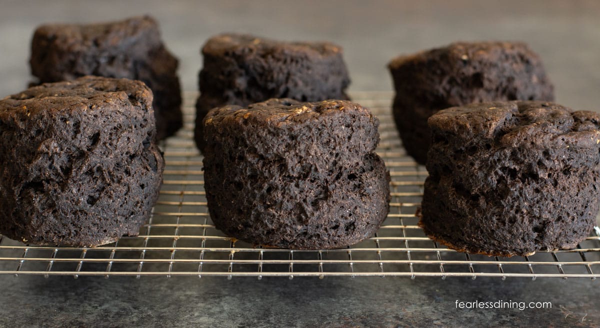 Chocolate biscuits cooling on a wire rack.