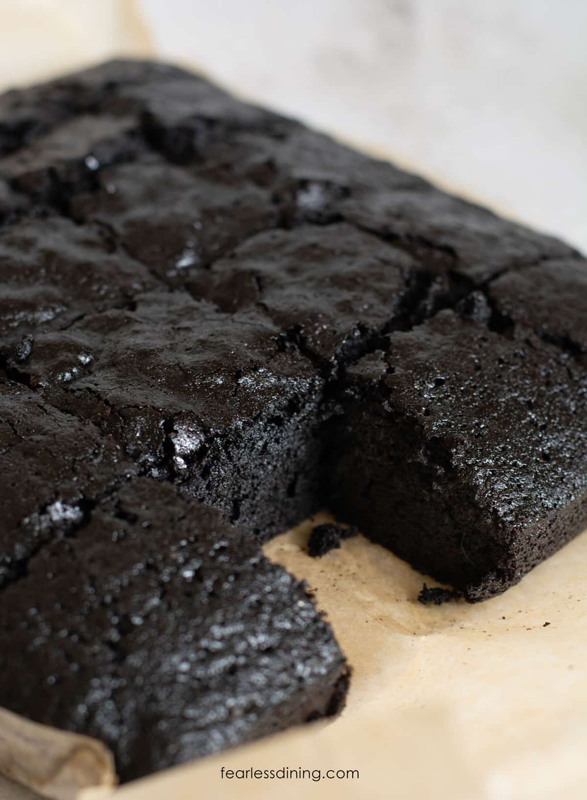 A photo of the brownies sliced. This is a close up so you can see both the crinkle top and the inside.