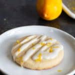 A gluten free lemon shortbread cookie topped with lemonade icing and lemon zest.