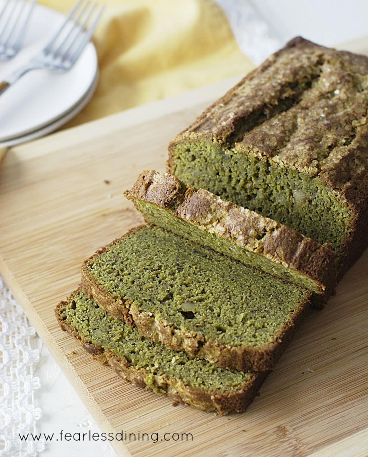 The top view of a sliced loaf of gluten-free matcha banana bread.