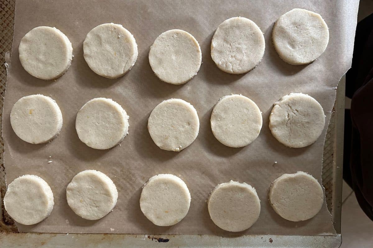 Shortbread cookie dough circles ready to bake.