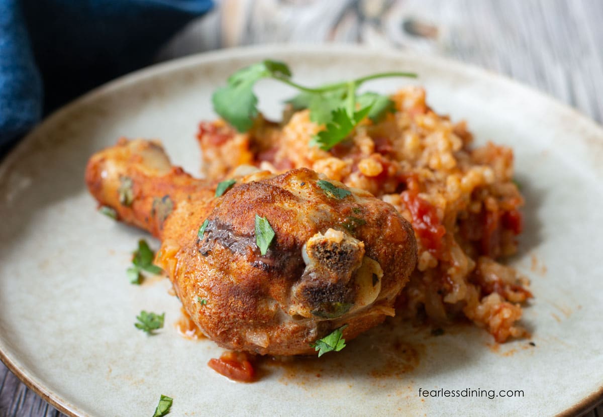 A dinner plate filled with chicken and rice.
