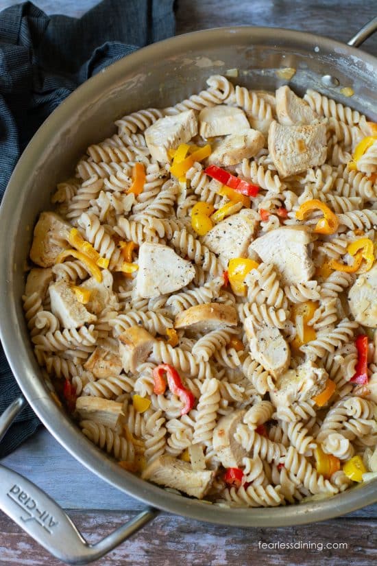 The cooked cajun chicken pasta in a large skillet.