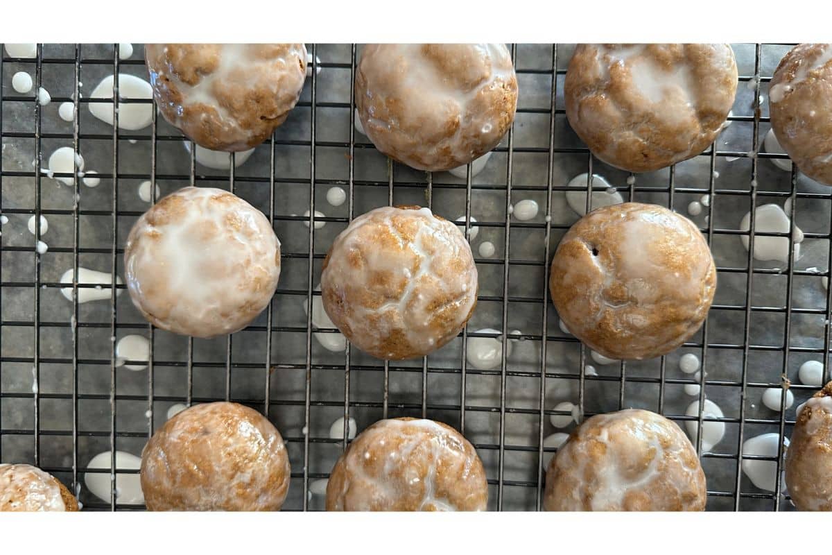 Glazed lebkuchen cookies drying on a cooling rack.