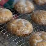 Iced gluten free lebkuchen cookies on a cooling rack.