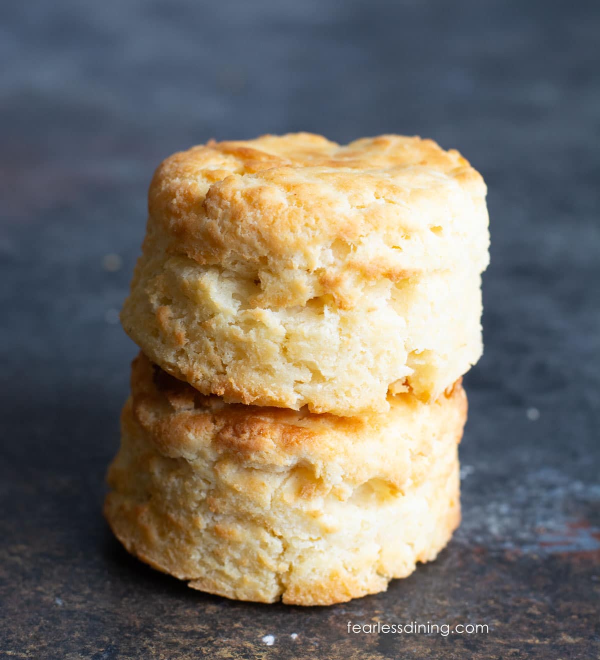 Two air fried biscuits on stacked up on top of each other.