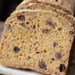 Slices of the gluten free Boston brown bread on a cutting board.