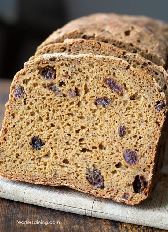 Slices of the gluten free Boston brown bread on a cutting board.