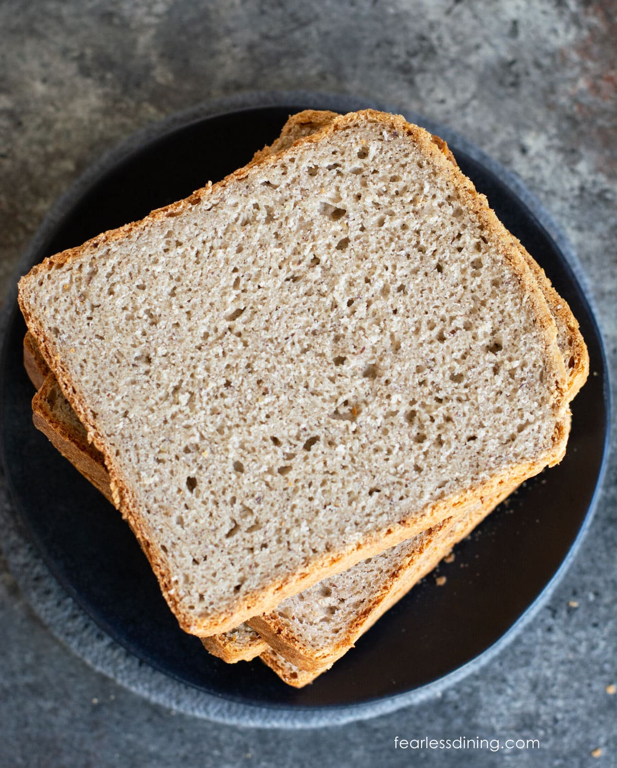 Slices of gf buckwheat bread on a plate.