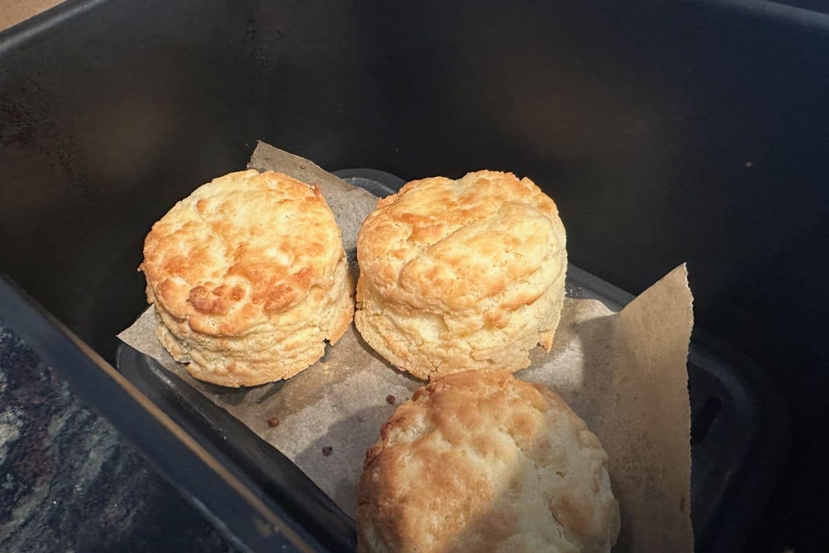 The cooked biscuits in the air fryer.