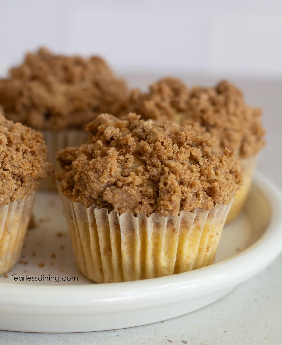 Baked muffins on a white platter.