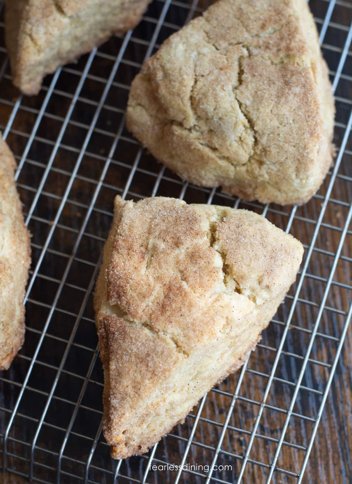 Snickerdoodle scones cooling on a wire rack.