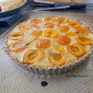The gluten-free apricot tart with vanilla custard is hot out of the oven.