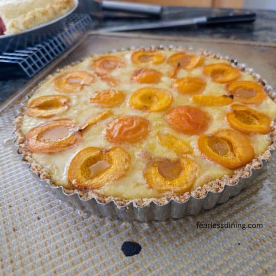The gluten-free apricot tart with vanilla custard is hot out of the oven.