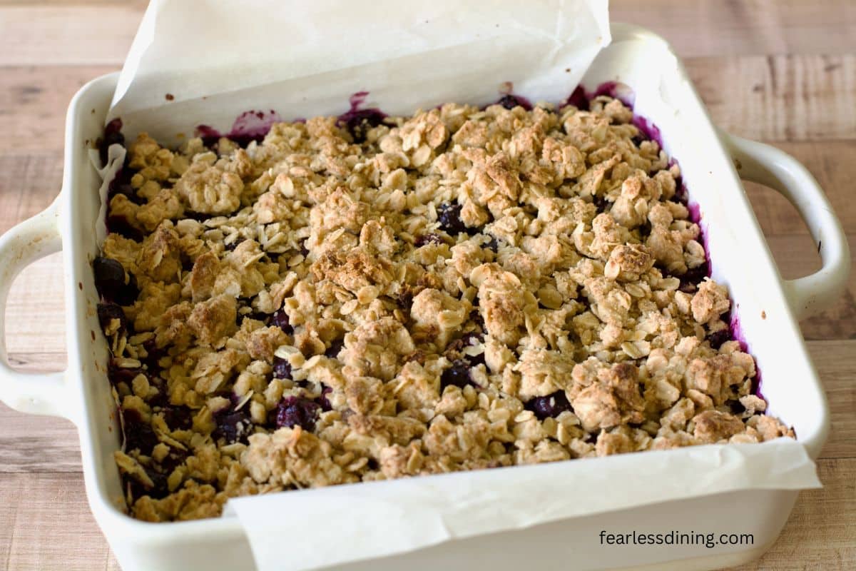 Gluten-free blueberry bars baked in a 9x9 pan.