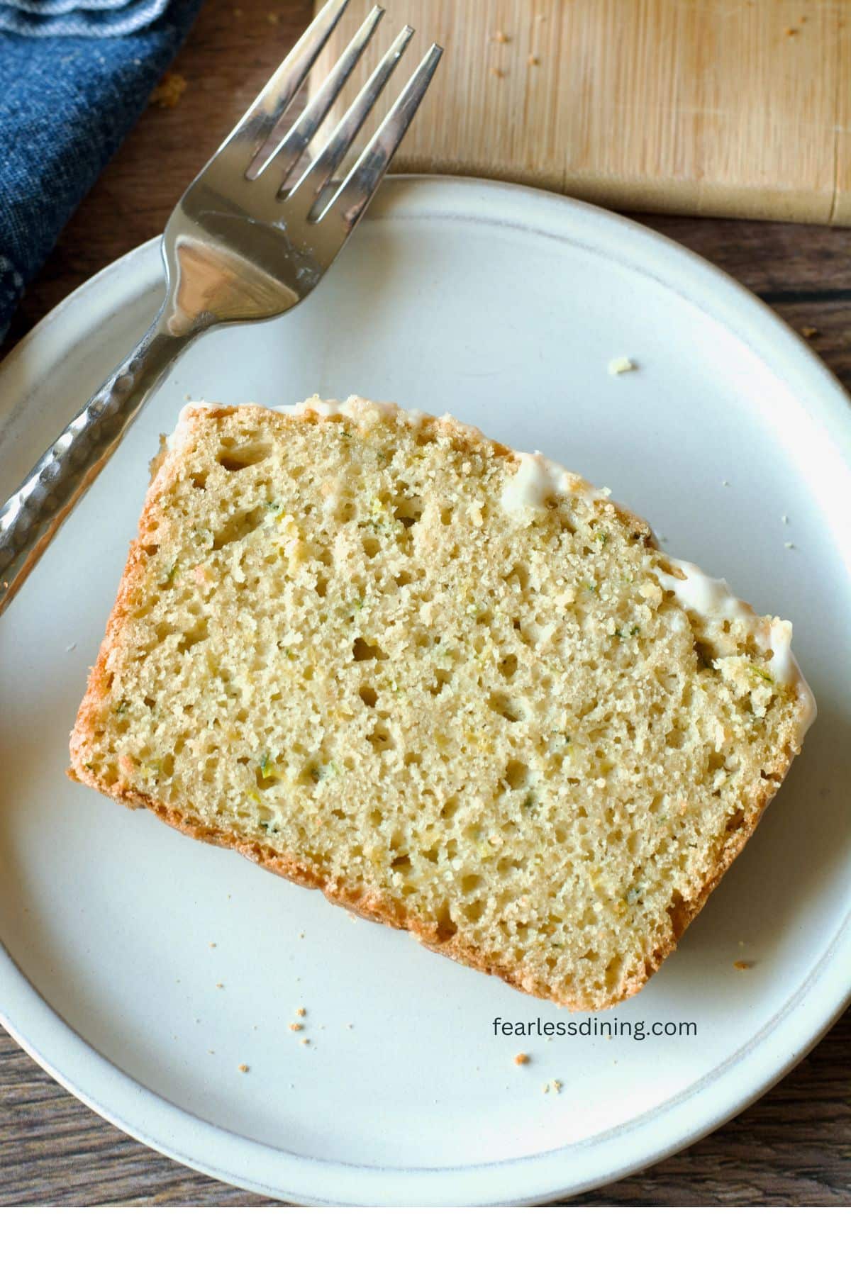 A close up of the slice of zucchini lemon bread.