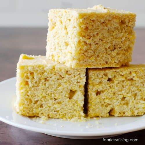 A stack of three pieces of gluten-free sourdough cornbread.