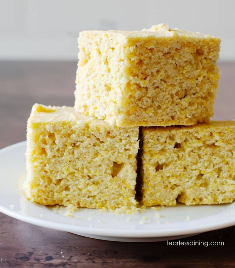 A stack of three pieces of gluten-free sourdough cornbread.