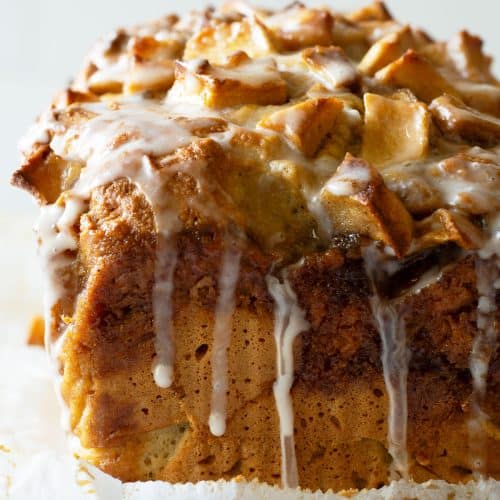 The front view of a loaf of gluten-free apple fritter bread with icing.