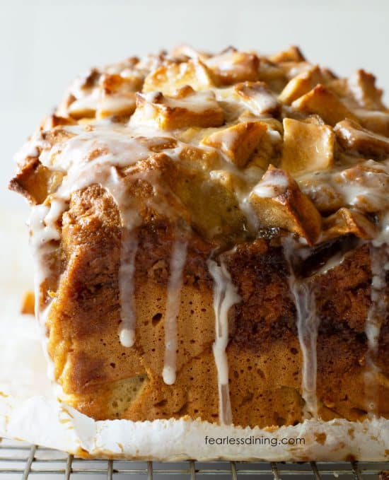 The front view of a loaf of gluten-free apple fritter bread with icing.
