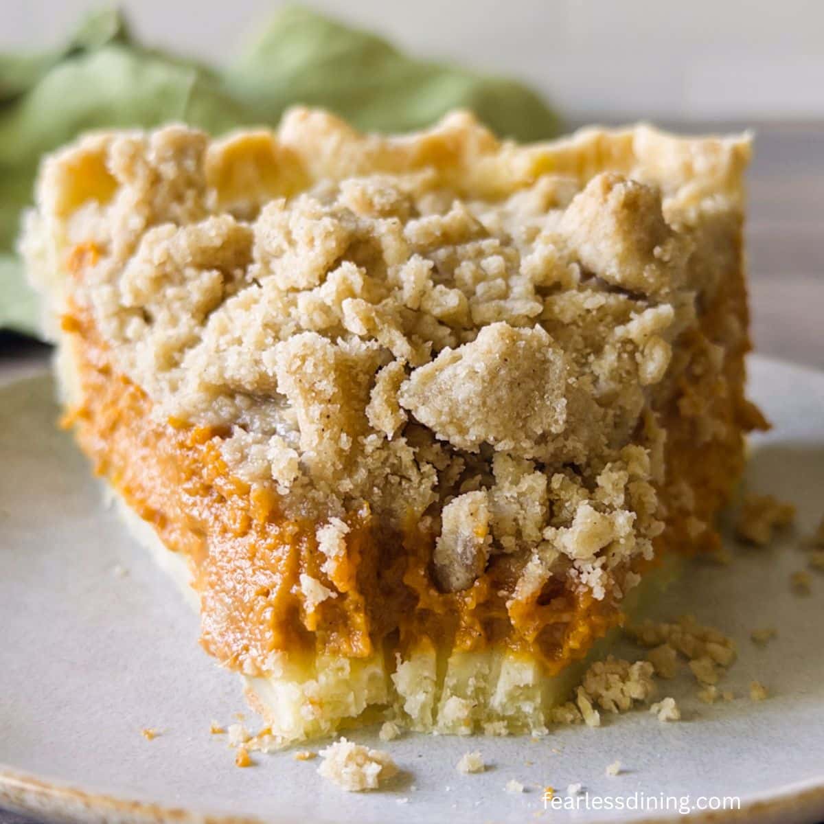 A close up of a slice of the gluten-free pumpkin streusel pie.
