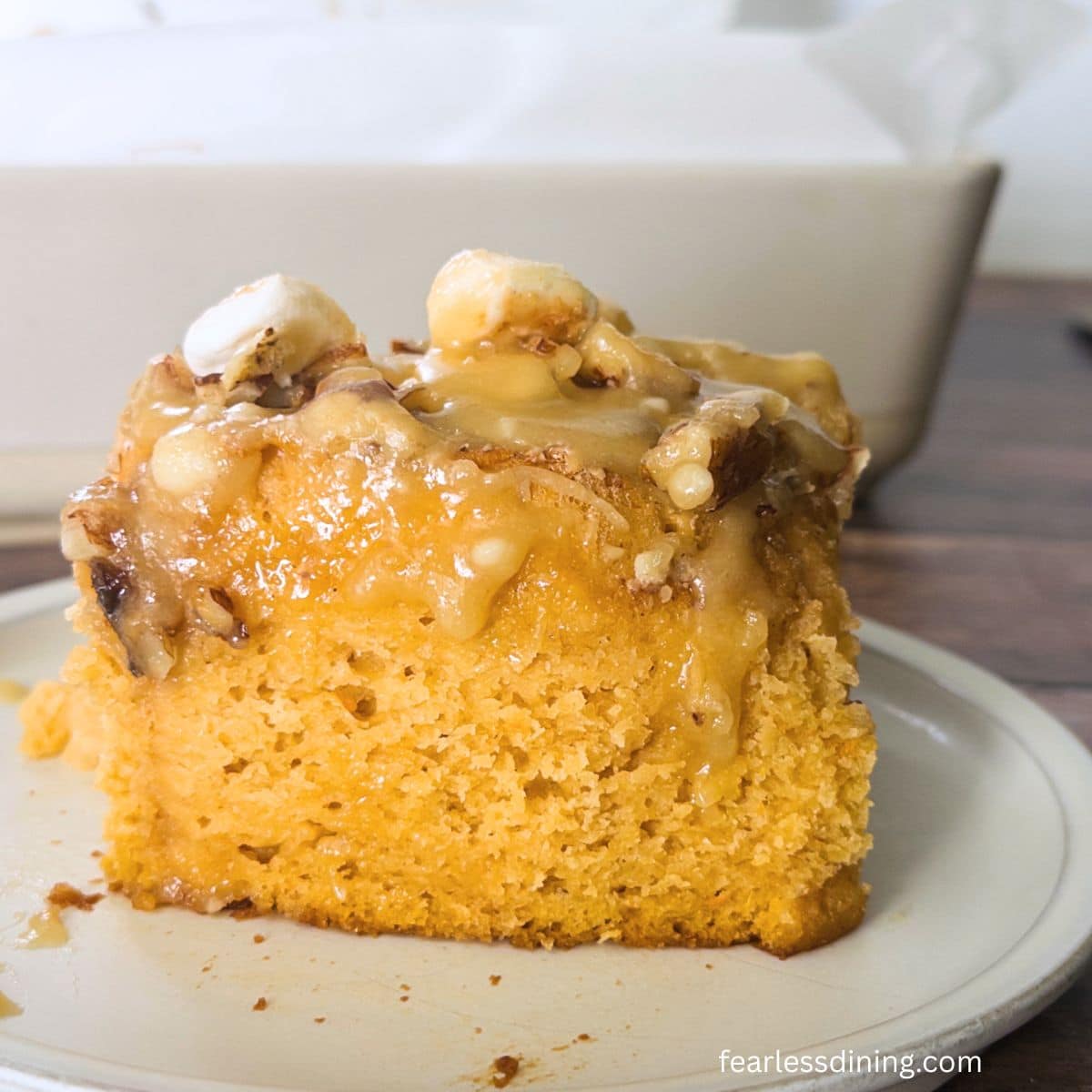 One of the gluten-free sweet potato cinnamon rolls on a plate.