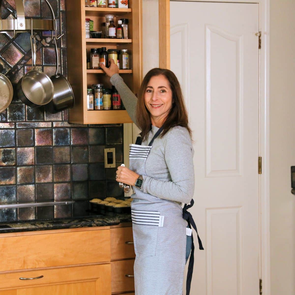 A picture of me grabbing a jar of spice.