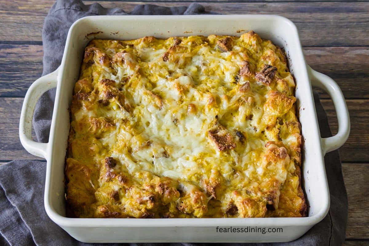 A baked bread pudding in a baking dish.