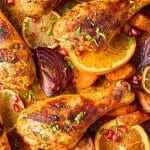 A Pinterest pin image of the chicken legs on a sheet pan.