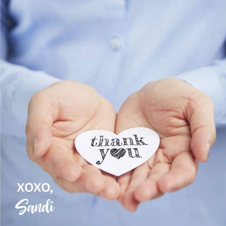 A thank you to my readers. My hands are holding a cut out heart note.